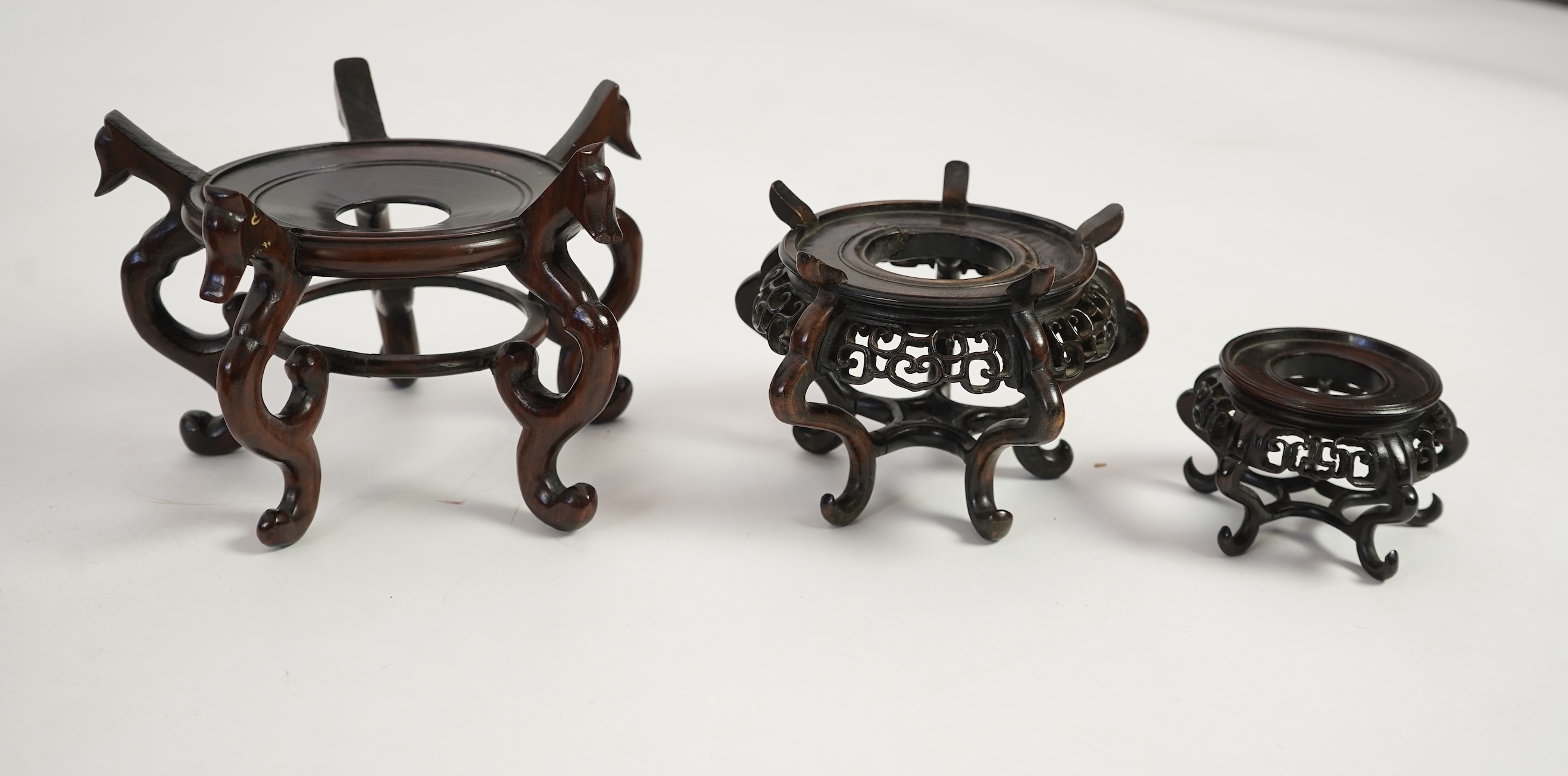 A group of sixteen Chinese hardwood stands together with a Japanese stand, 19th/20th century